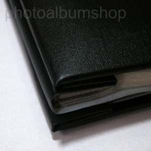 Detailed image showing black buckram cover and spine presentation from The Photo Album Shop