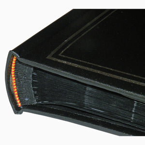 Detail of Basic Black photo album showing bookbound pages and closeup of cover material